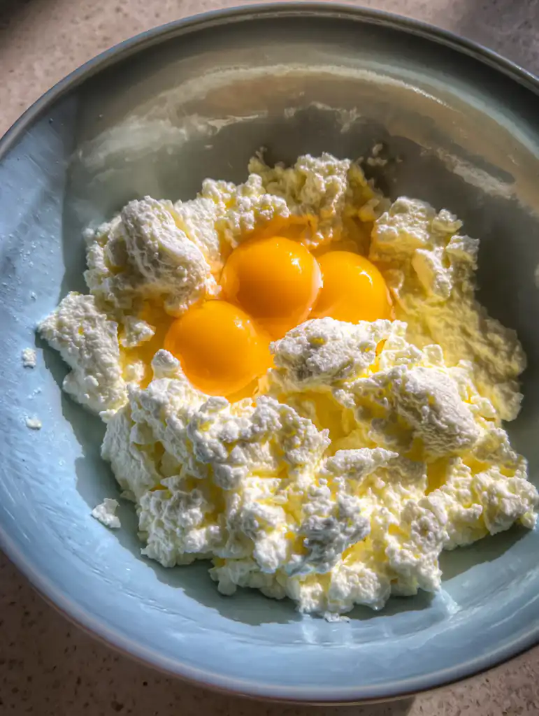 keto cottage cheese egg mixing eggs and cottage cheese before cooking