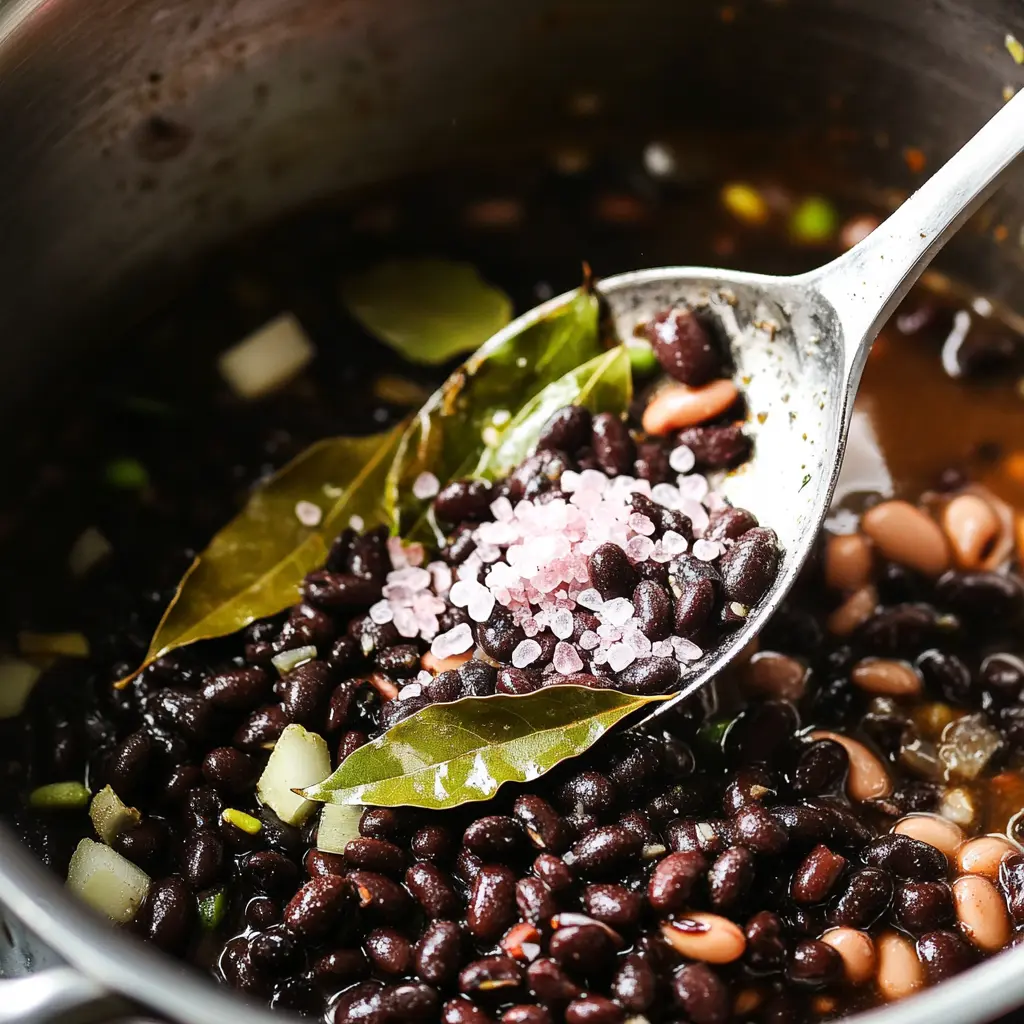 Adding beans and seasonings to Brazilian Mounjaro
