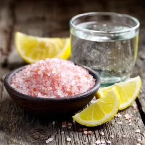 Ingredients for making pink salt weight loss drink: pink Himalayan salt, water, and lemon